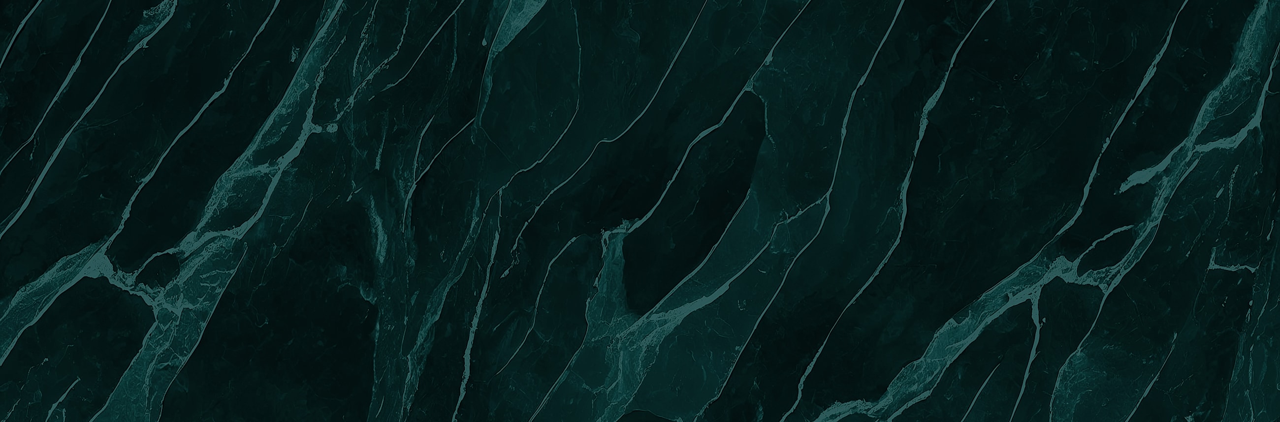 Dark green marble texture with white veining.