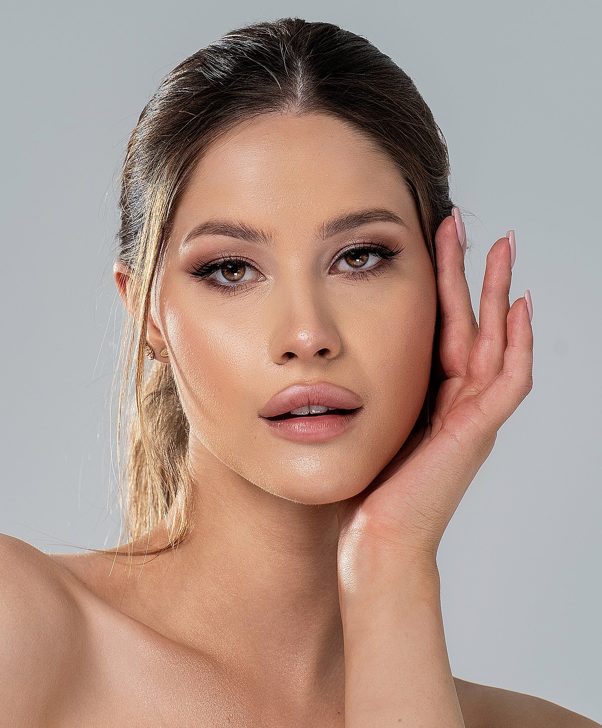 Woman with natural makeup and soft expression.